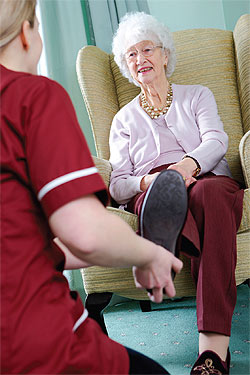 elderly woman with caregiver