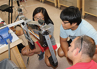 Third-year students with prototype