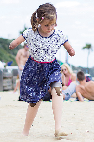 Charlotte running on beach